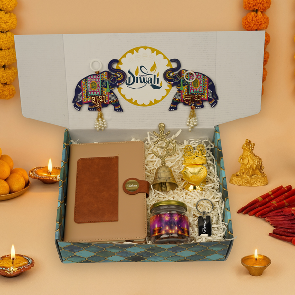 "Personalized Diwali Gift Hamper 2.0-TANN“Dual Shade Diary, Metal Keychain, Om Brass Bell, Laxmi Ganesh Diya, Almond Jar & Shubh Labh Latkan – Festive Gift Box”